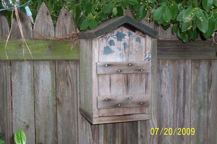garden storage box on fence