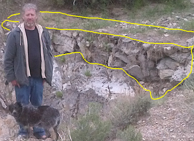 Close up of a wire gabion basket containing around 38 cubic feet of stone. It took days to build. Filled with sediment during first runoff event. 