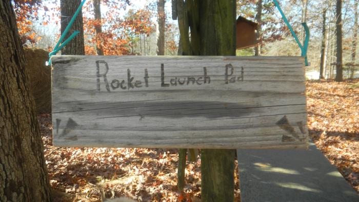 A woodburned sign that says 