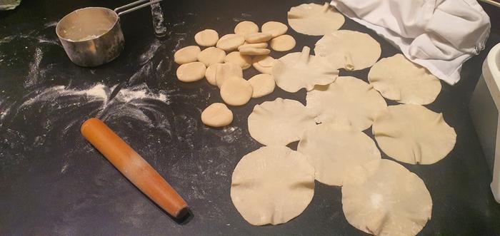 Hot water pastry being rolled out for dumplings