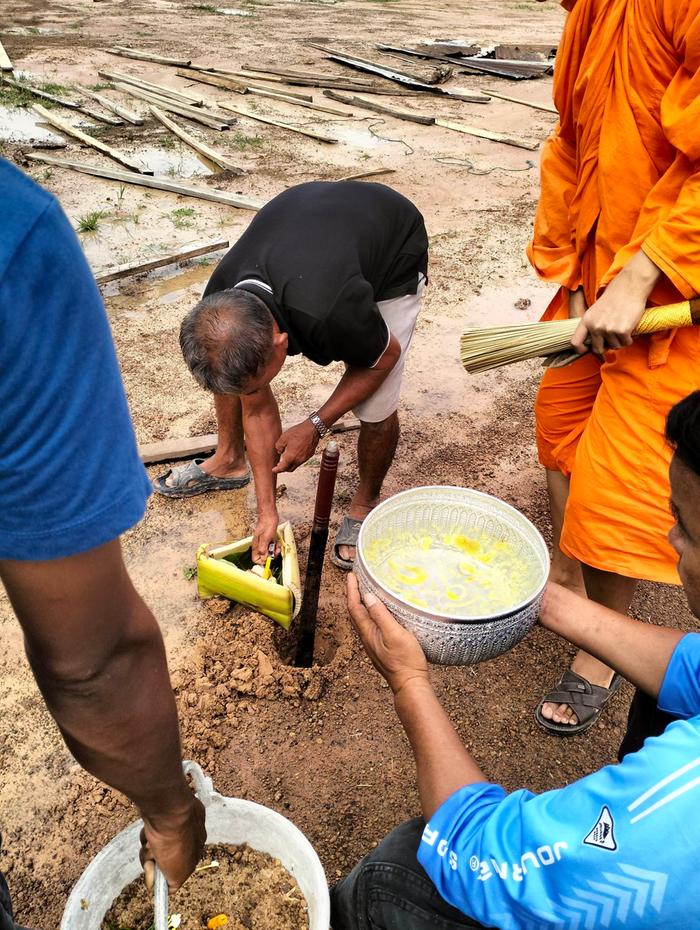 where the mount was a hold has been dug out and all gave a little personal gift into it. The hole then gets closed while the Monk chantes his prayers.