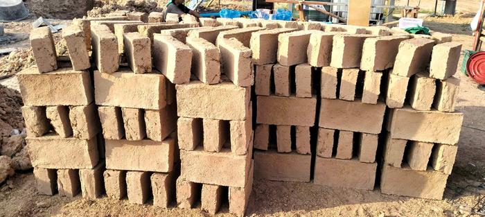 A huge amount of mud bricks are made by just a husband and his wife