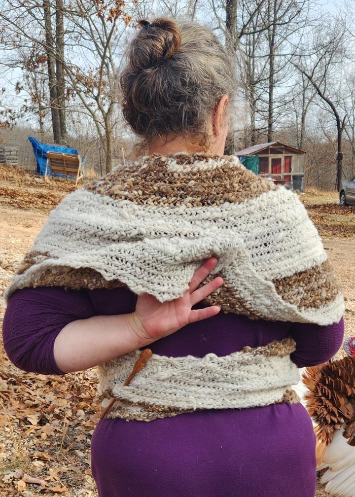 The too-long overlap, with only a shawl pin closure