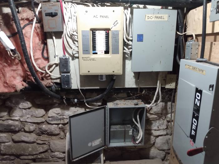 It was very common to have DC panels and AC panels side by side in older off grid systems