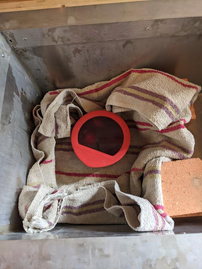Rice rewarming with broth in hay box