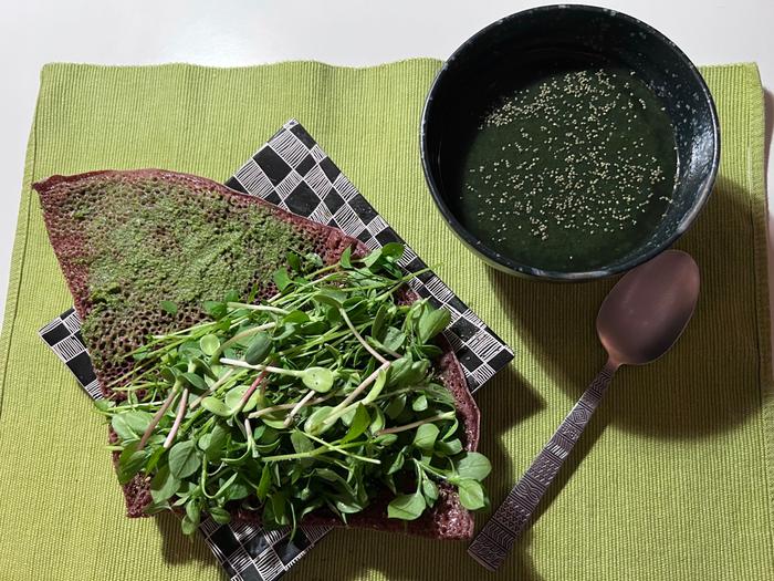 More Chickweed which grows right outside where I live. Some of my windowsill grown sunflower seed greens on it too. On Ethiopian Teff Injera flatbread. Newly popping up nettles for green soup. Nettle seeds from last year on everything!