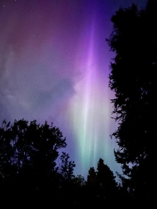 Brilliant purple pink and green aurora