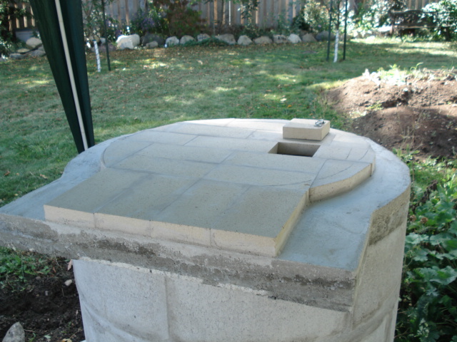 The bread oven was conventionally fired with a fire in the oven before baking. I added a four inch rocket which could be fired by stick wood in the conventional j tube rocket.