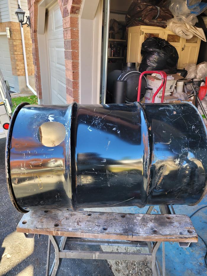 A steel barrel that was painted to house a rocket oven
