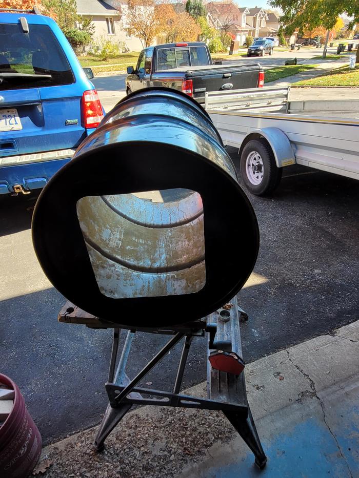 A squarish cut in the bottom of a steel barrel