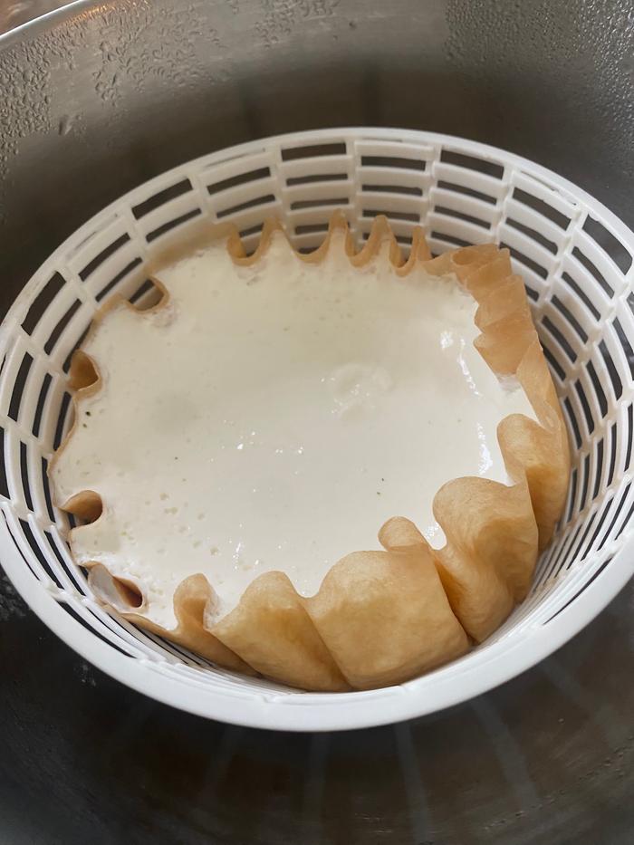 I poured the quart of kefir into a paper coffee filter in a cheese basket and drained it overnight 
