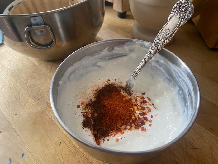 Chipotle chile powder and some chile flakes for flavor