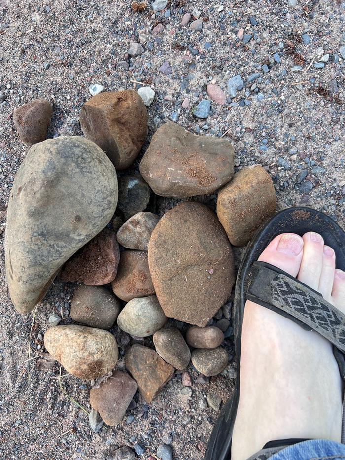 rocks next to a foot for scale