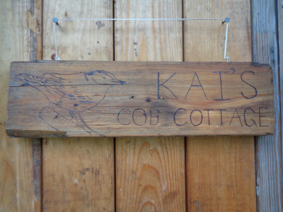 A new sign with the cob house's new official name