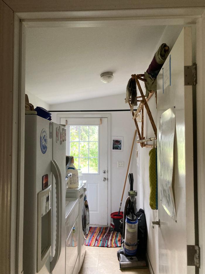 This laundry room is getting some shelving (round wood?)