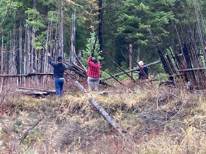 junk pole fence being rebuilt