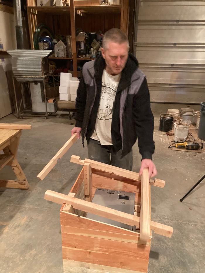 Stephen doing notches on the lid for the battery box 