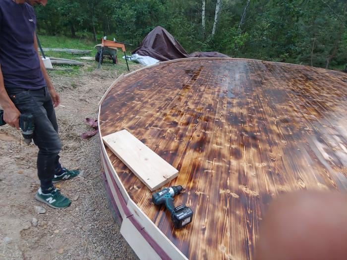 Added sides + we burned the floor boards and oiled them w/ double boiled linseed oil the day before building the yurt (Bad idea! Needed more to cure)