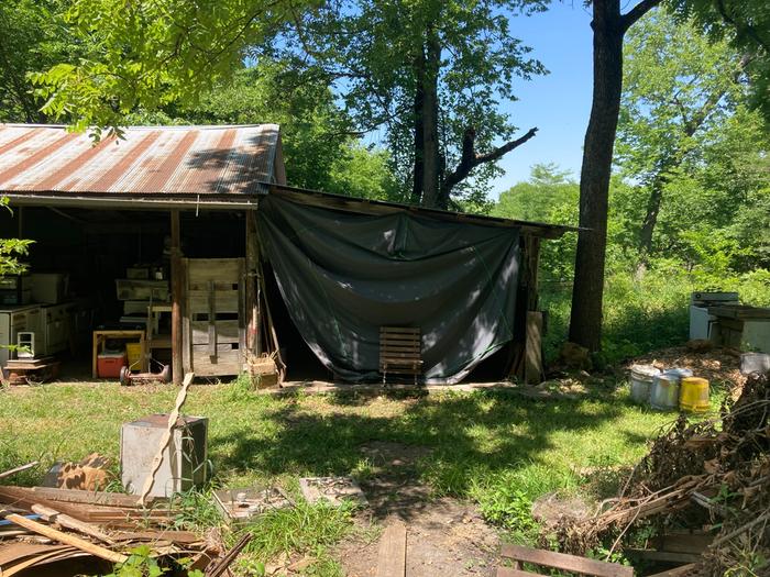 Front of the space covered with a tarp 