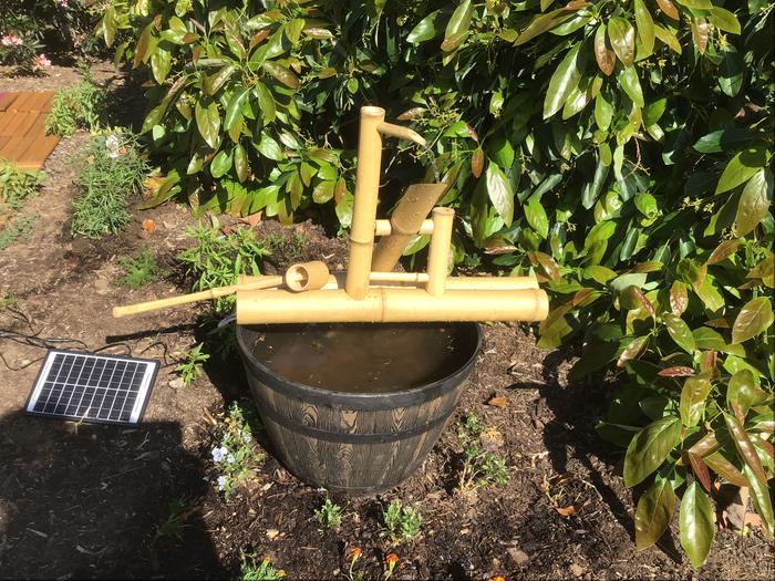 Top bamboo fountain bought online, bottom made with rocks from the garden and an old planter