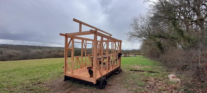 Stud framing in place, with ridge beam