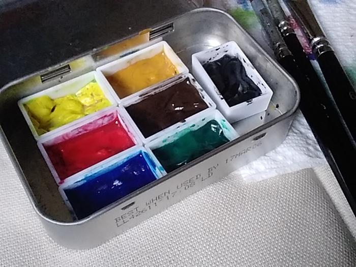 Temporary home for some watercolour paints in an altoids tin