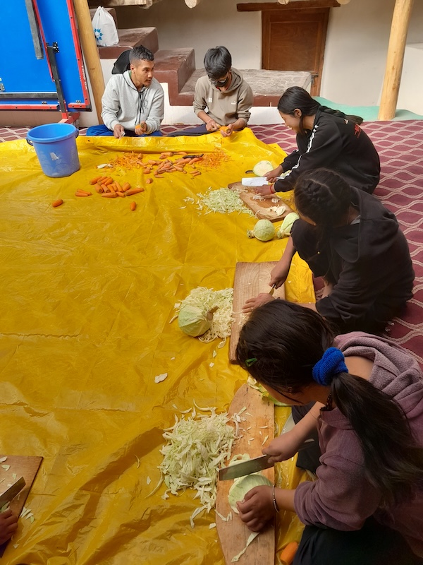 Students chopping veg for the huge batches