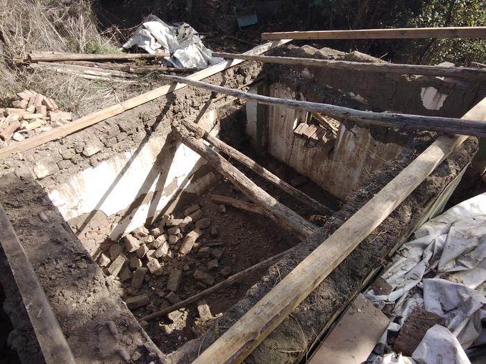 Note the pile of cob bricks I took out of the wall. I'm going to reuse them, add more straw and make a cob floor