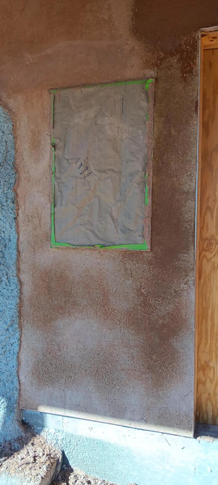 Finished plaster with clay slip, wet plaster, and splotchy whitening drying plaster
