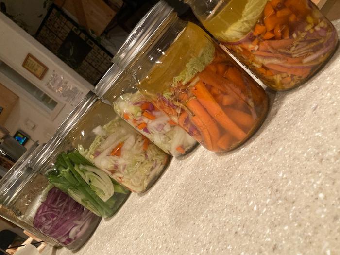 All kinds of fermented vegetable in black jars