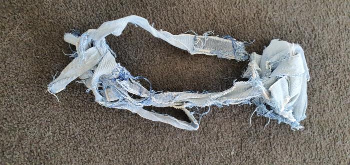 Destroyed denim strip chew toy