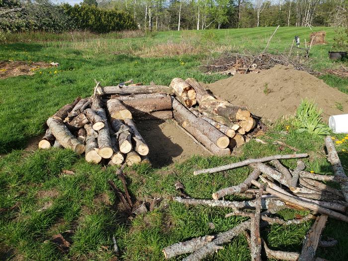stacked logs in a keyhole shape