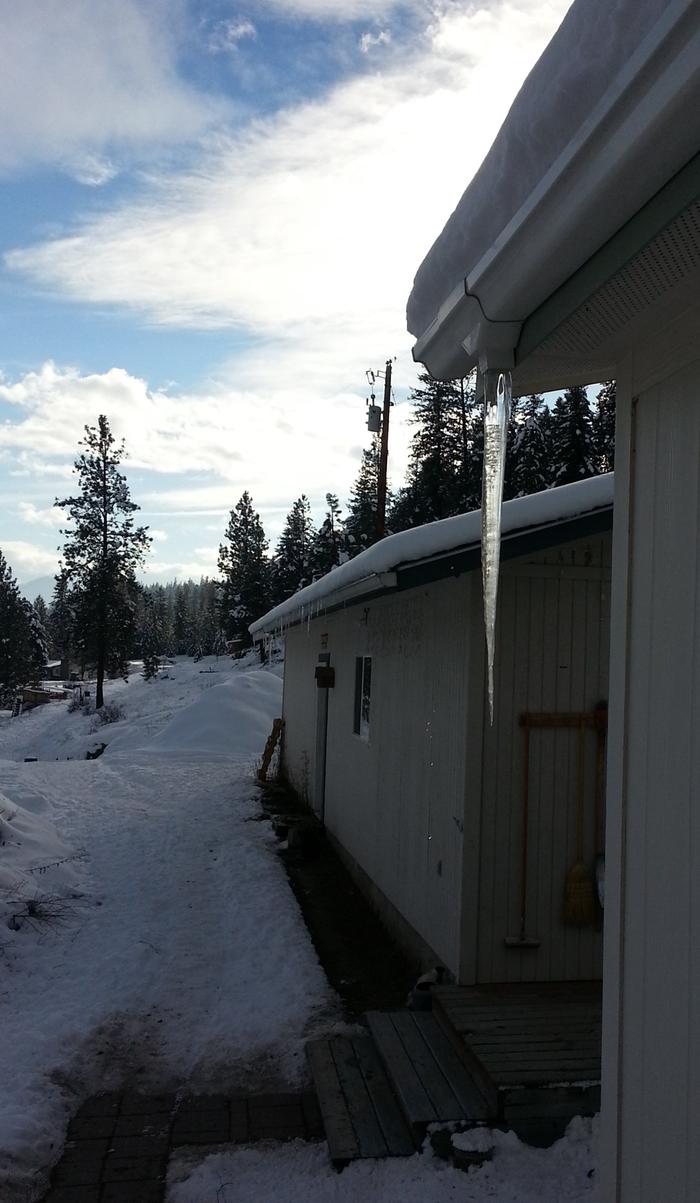 HUGE icicle where there used to be a downspout - more, if you can see them along the front of the office/garage