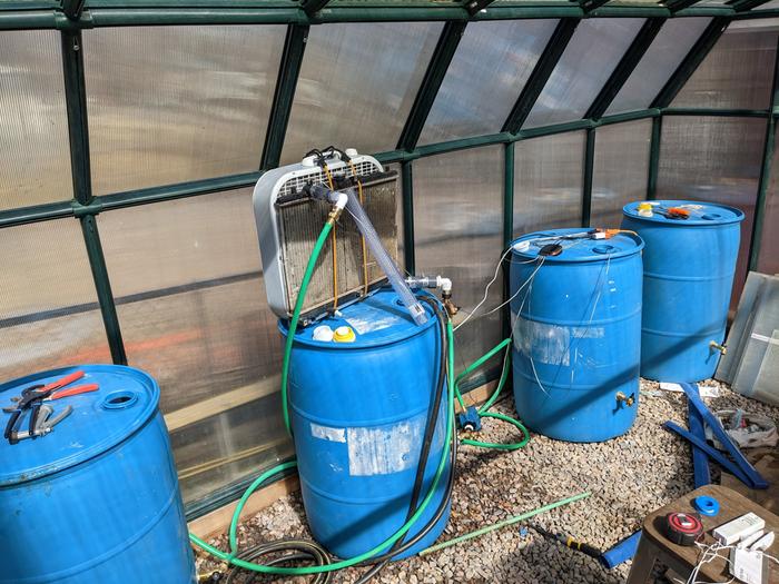 set-up for barrels as thermal mass in greenhouse