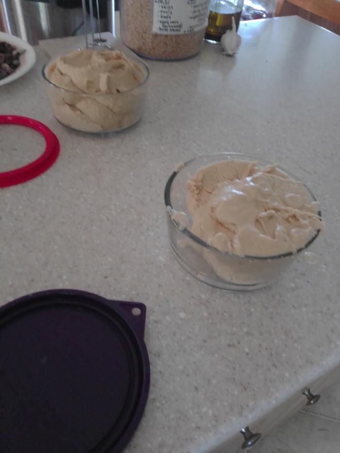 hummus under construction on a counter