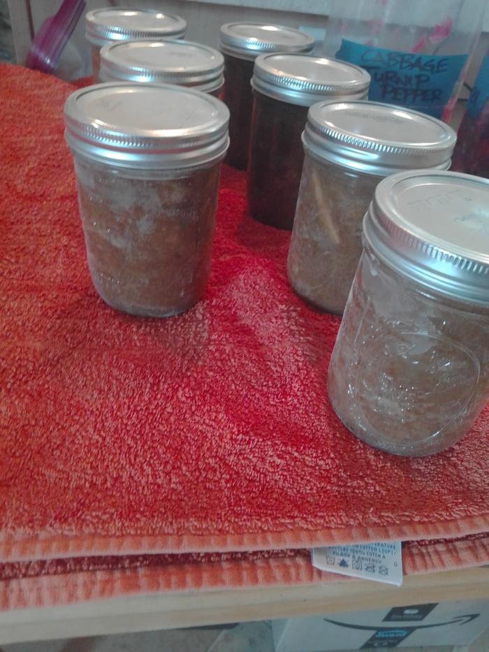 rhubarb jam in jars sitting on a towel