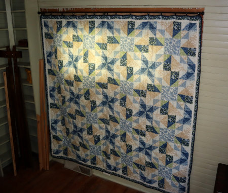 Quilt printed bedspread as the front window curtain