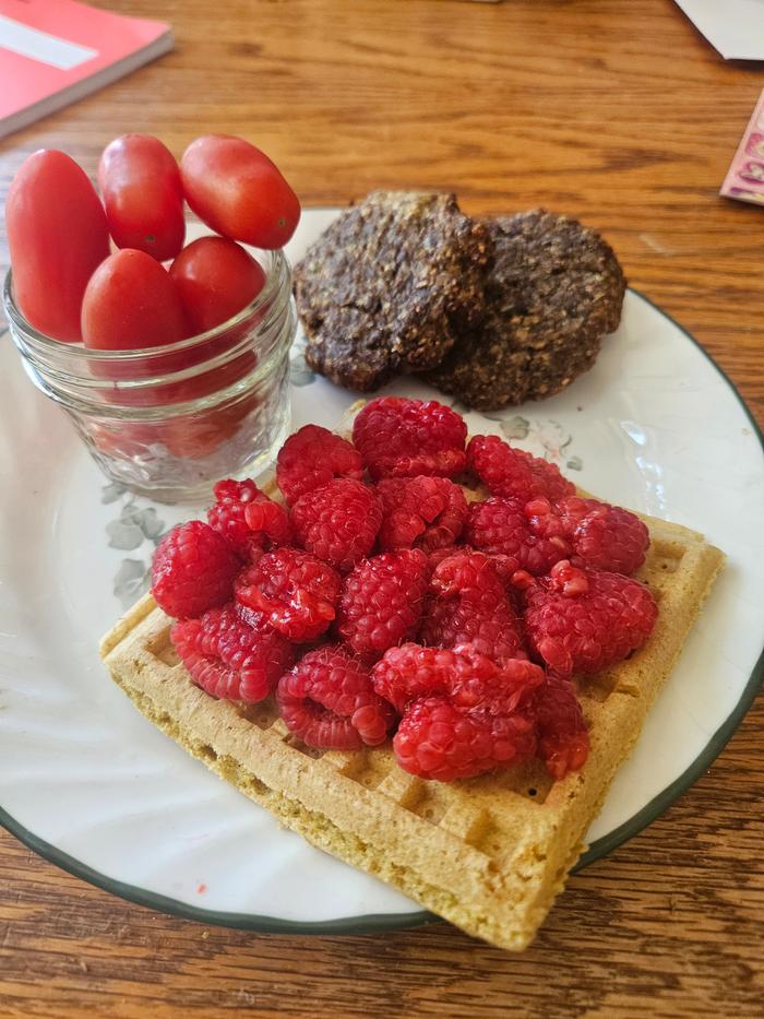 Tomatoes, deer sausage, waffle, cherry tomatoes