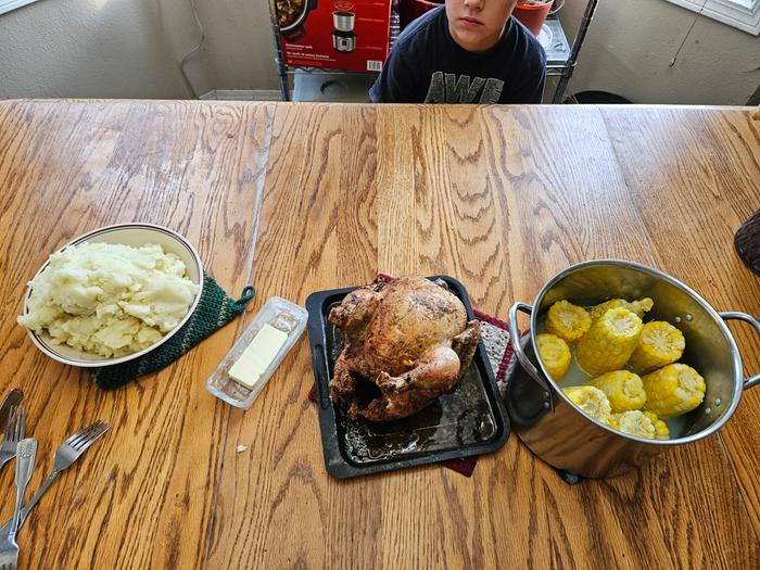 Roast chicken, mashed potatoes, corn in the cob