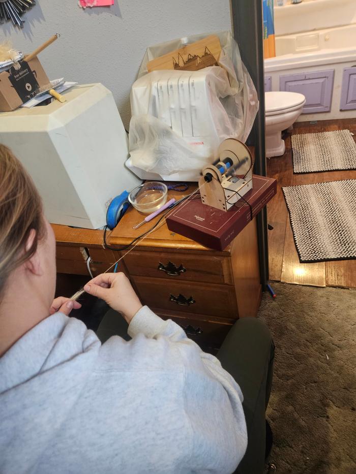 Spinning the flax, counter-clockwise, with a bowl of water