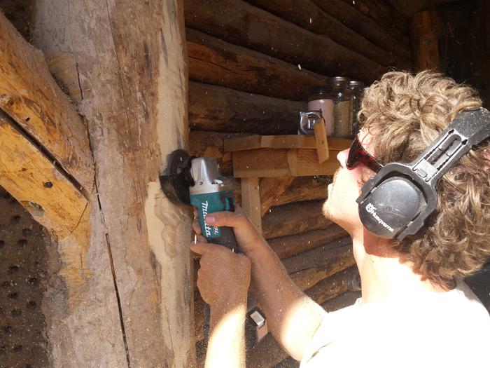 Zach using his wood grinder thing to create some room for the window buck.