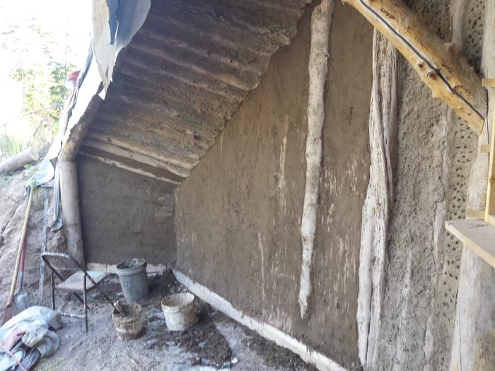 The newly plastered wall. The light splotches are clay slip splatters, which will be covered with the final coat.