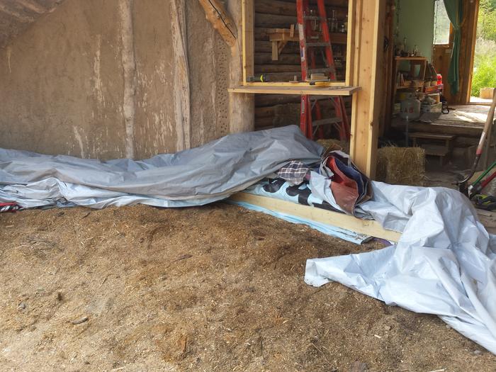 the top tarps attached to the wall