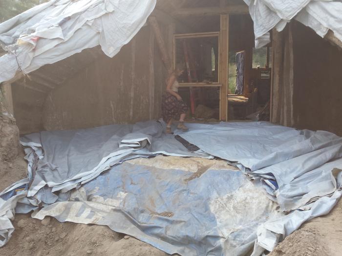 The umbrella all laid out, ready to be covered with dirt.