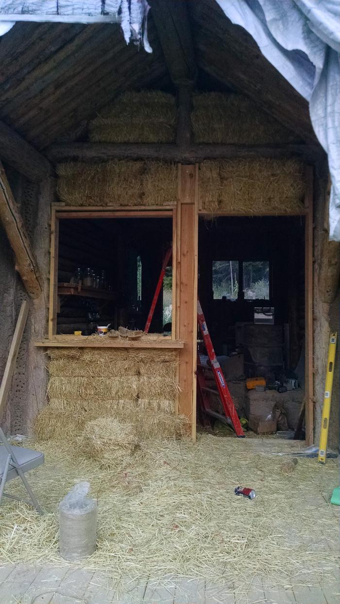 The wall filled in with bales.
