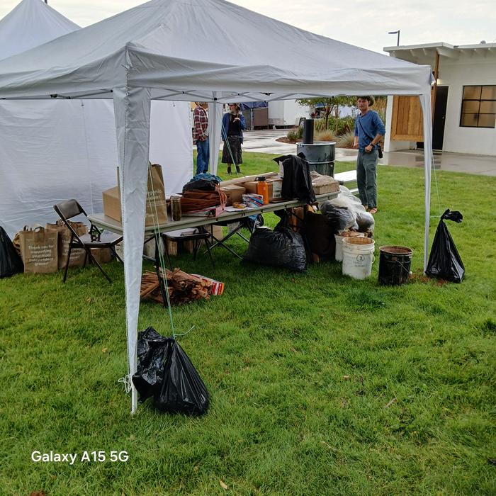 A photo of the setup at the Western Montana State Fair (Uncle Mud and fellow boot Ollie in the BG L to R)