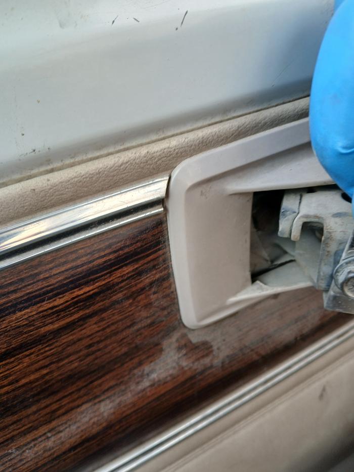 Removed the door handle to expose the lever