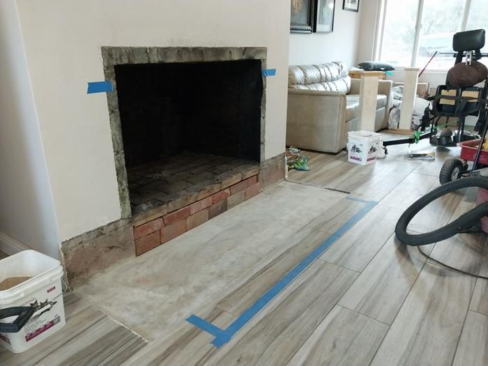 The hearth removed and firebox and smokeshelf were thoroughly cleaned; appears to have never been done. I'll be taking out some, or all, of the firebrick floor to make room for the stove's chimney.