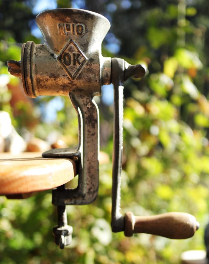 A number 10 food chopper set up on a table outside