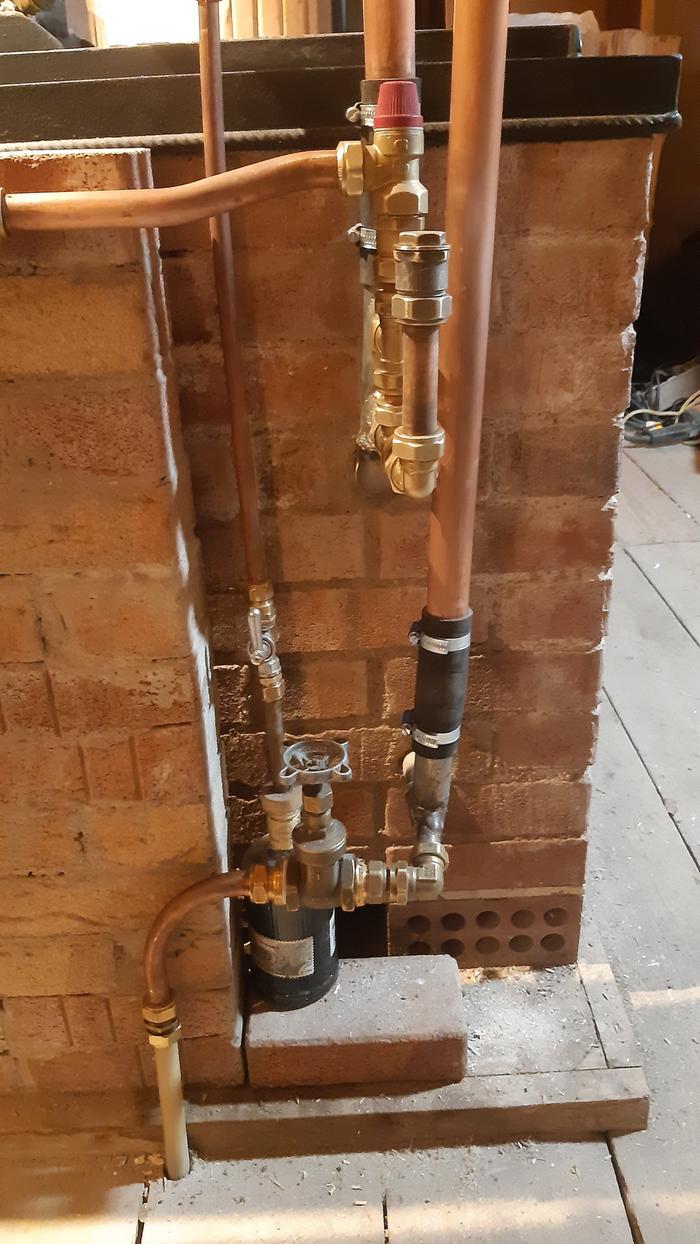 Temperature and pressure release valves for a rocket water heater built into a Contnental rocket stove